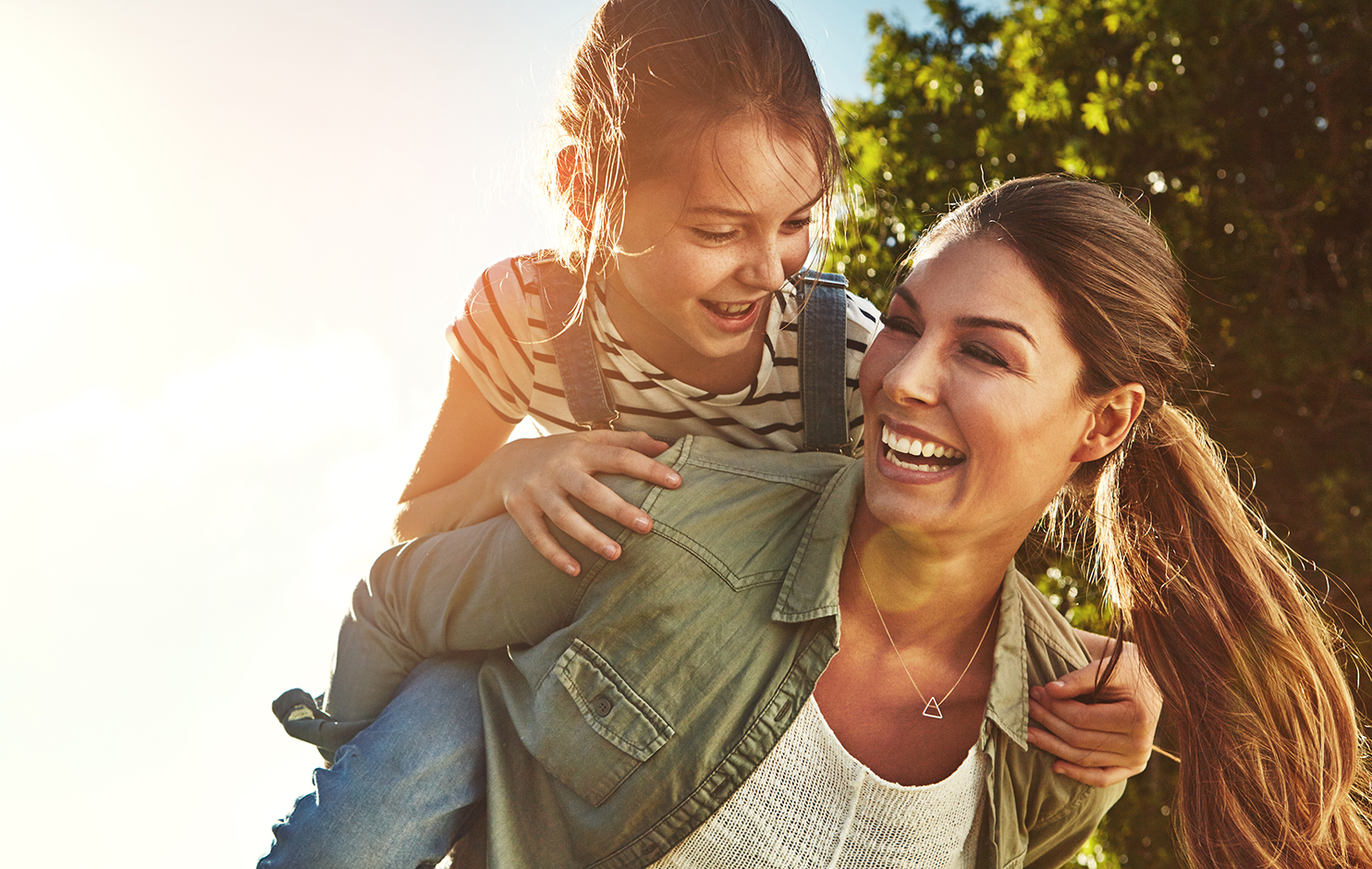 Woman with child piggyback